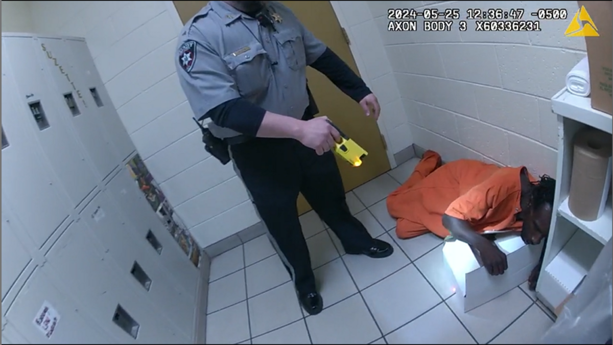 Stephen Fossett, a former inmate at the Bibb County Jail booked on trespassing charges, lying on the floor after being tased on May 25, 2024. He died some minutes after a struggle with deputies.